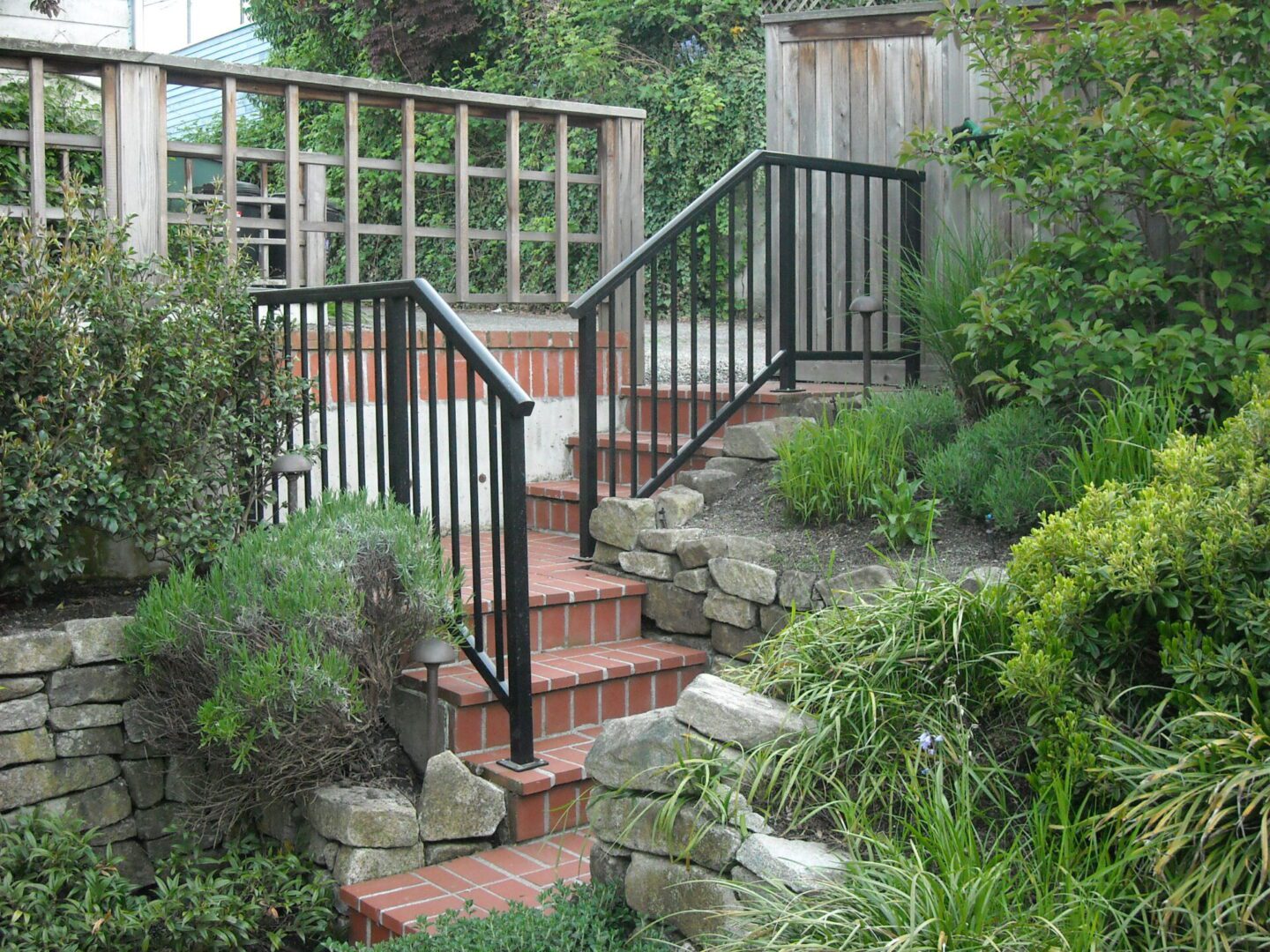 Railings built unique and custom for a home's exterior using a picket rail design