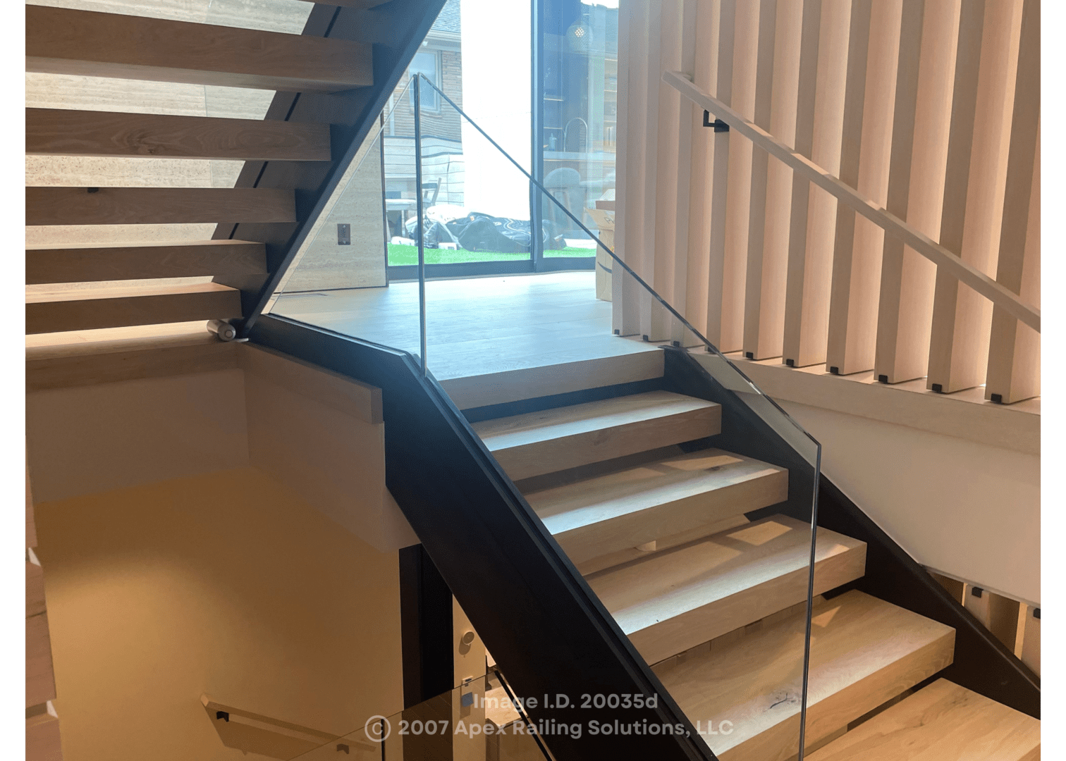 Custom staircase railings designed and installed using glass, aluminum or other materials