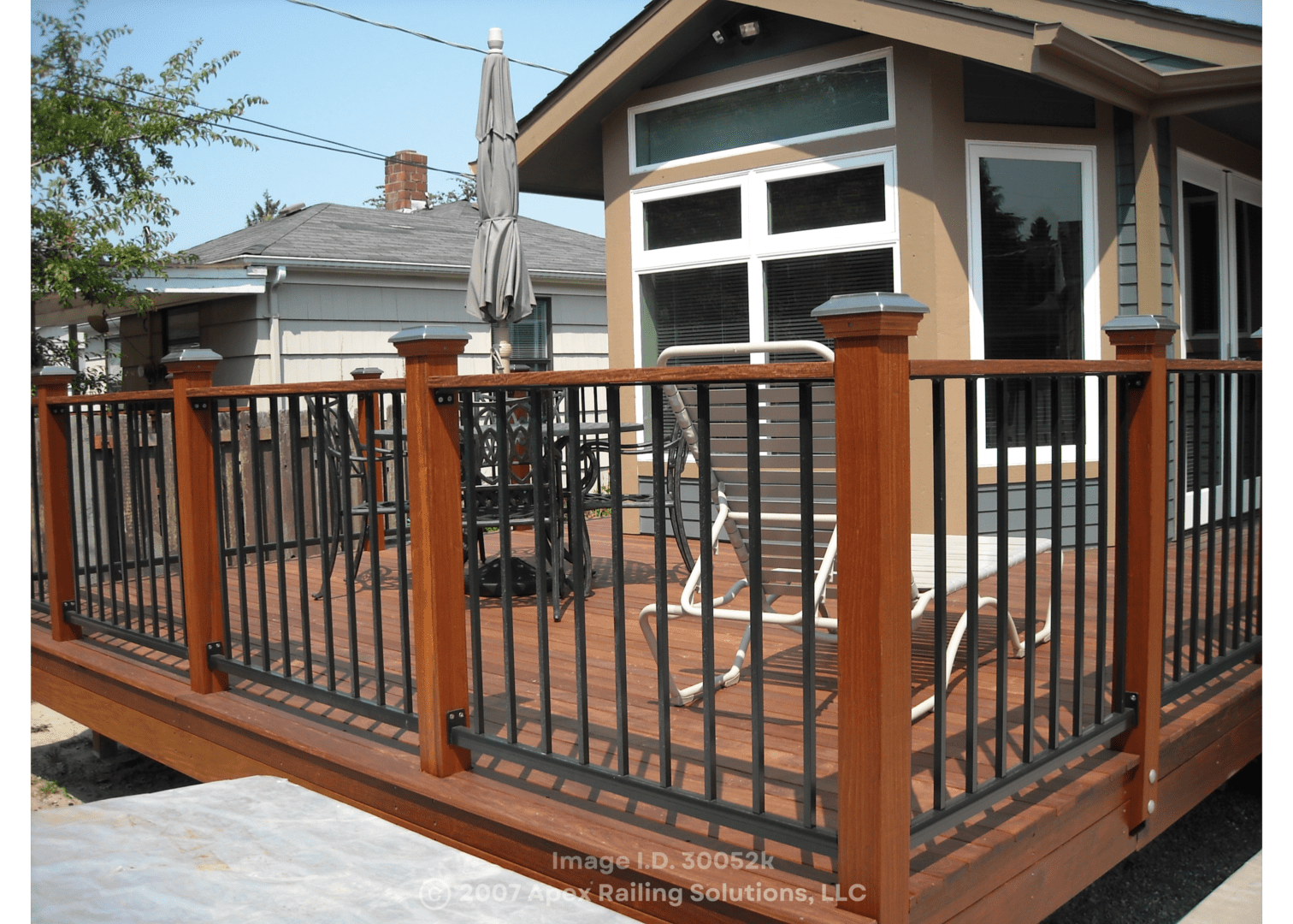 An outdoor space of a property with brown handrails