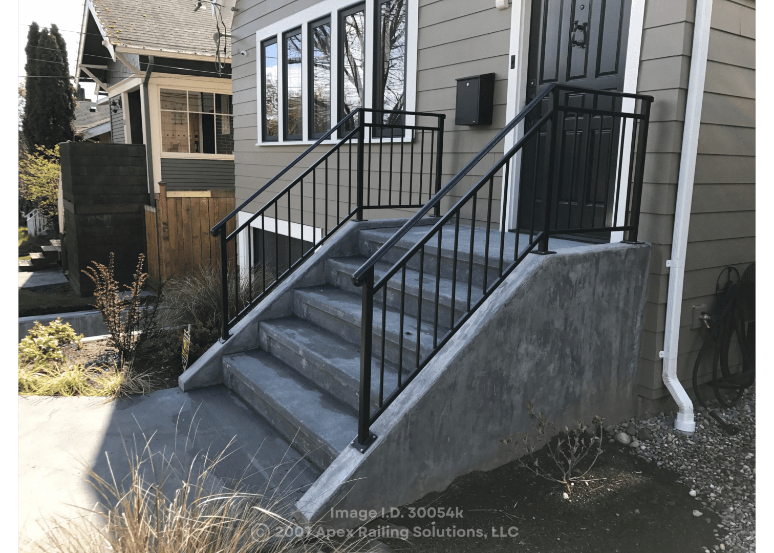A staircase leading to a house’s front door